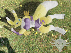 Renamon laying on the grass by Skamiroth
