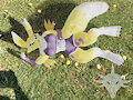 Renamon laying on the grass by Skamiroth