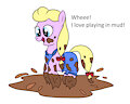Penny jumping in muddy puddles